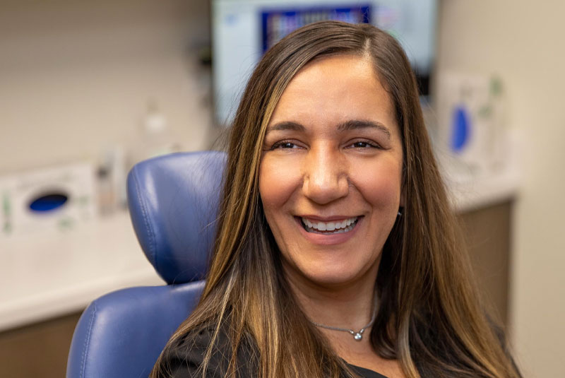 julie with new teeth happy and confident