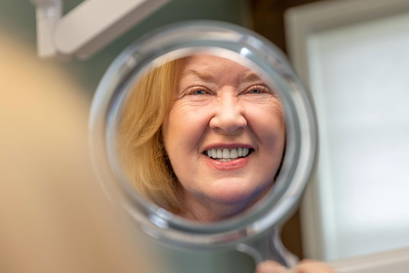 peggy after implants smiling happy